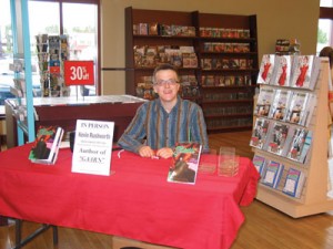 Photo courtesy of Kevin Rushworth.  Kevin Rushworth as an eager young writer, signing his first  novel, Gaarn, which he published at the age of 18