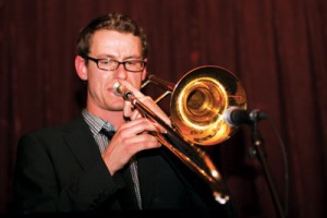 Photo by Kevin Rushworth. Here, Carsten Rubeling is rocking the trombone while performing with soul band Joanna and the Acrobatiks. He is also a professor in the two-year music performance diploma offered at Mount Royal University. 