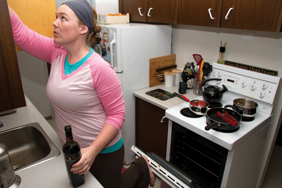   Photo by Jorden Dixon.  Mount Royal student Kate McMackin deals with cramped cooking quarters in her off-campus home. Whatever your kitchen resources, it’s possible to eat right as a student. 