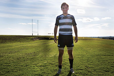 The captain of the rugby team stands on the field after a game with U of A. Louden believes he was selected for the captain position because of his “quiet leadership.” Photo: Claire Bourgeois