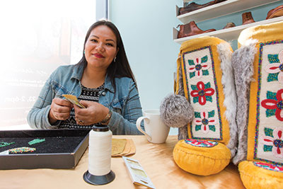 Rosary Spence, a Cree artist and designer, brings one-of-a-kind Aboriginal fashions to Calgary. Spence works with Manitobah Mukluks, a company that contracts artists from all across Canada to help keep Aboriginal traditions alive. Photo: Jesse Yardley