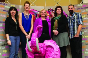 Frank, the pink elephant mascot and the panel speakers from left to right: Gaye Warthe, Zoe Slusar, Cathy Carter-Snell, Scharie Tavcer, and Joe McGuire. Frank is symbolic of issues that are not being talked about enough | Photo by Amy Tucker